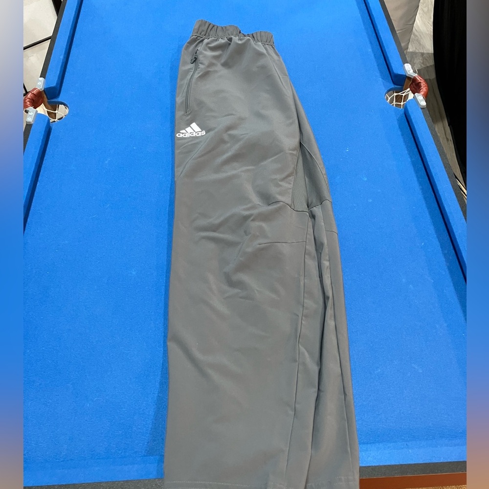 Adidas track pants.